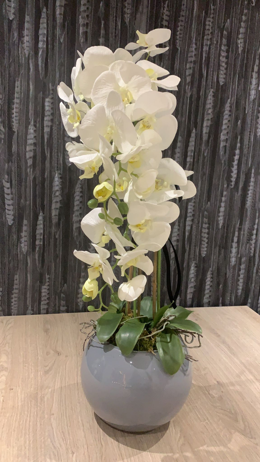 Grey bowl faux orchid arrangement